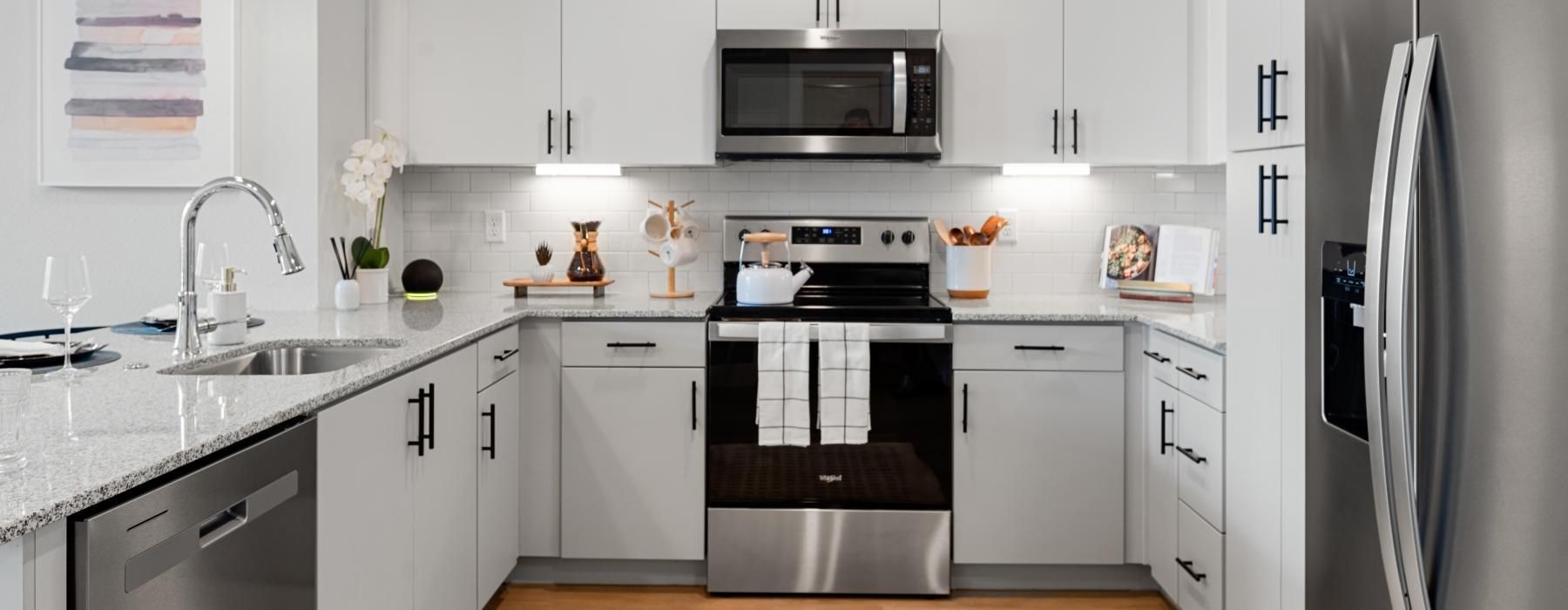 a kitchen with under cabinet lighting