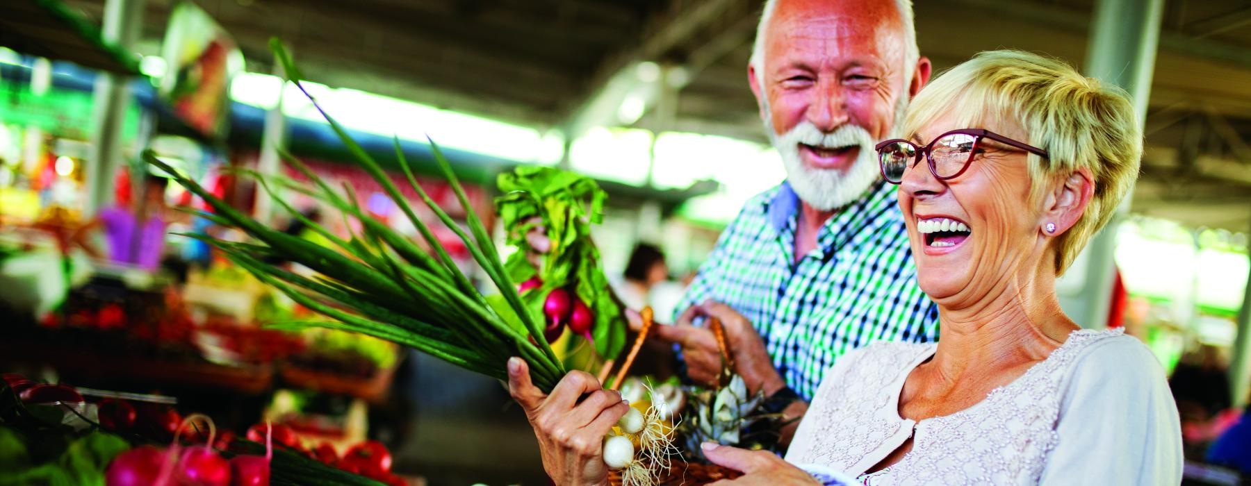 couple with groceries in a store