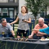 a group of people laughing around a fire