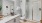 bathroom with a walk-in shower and sink